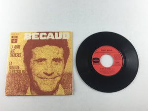 Gilbert Becaud La Vente Aux Encheres / La Solitude ca N'existe Pas Used 45 RPM 7" Vinyl VG+\VG+